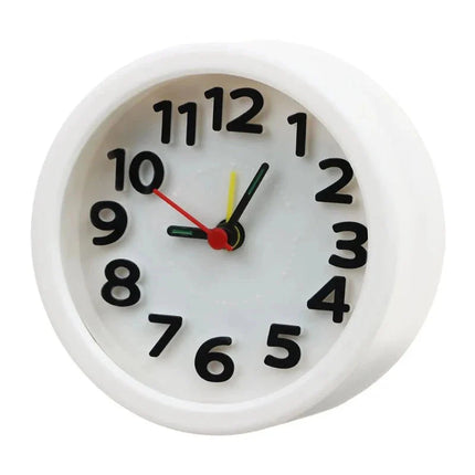 Liten rund analog batteridriven väckarklocka