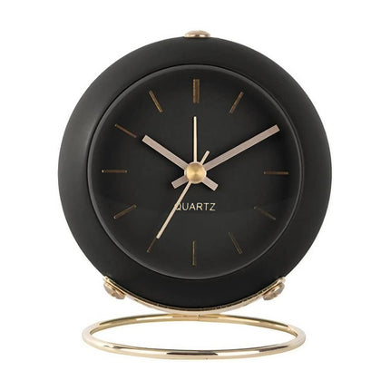Svart vintage väckarklocka med guldstativ