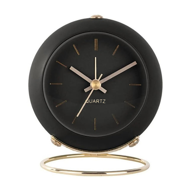 Svart vintage väckarklocka med guldstativ